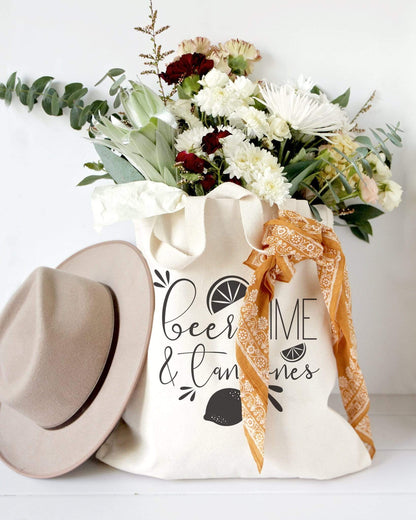 Turquoise Andromeda Totes & Beach Bags Beer, Lime and Tan Lines Tote Bag